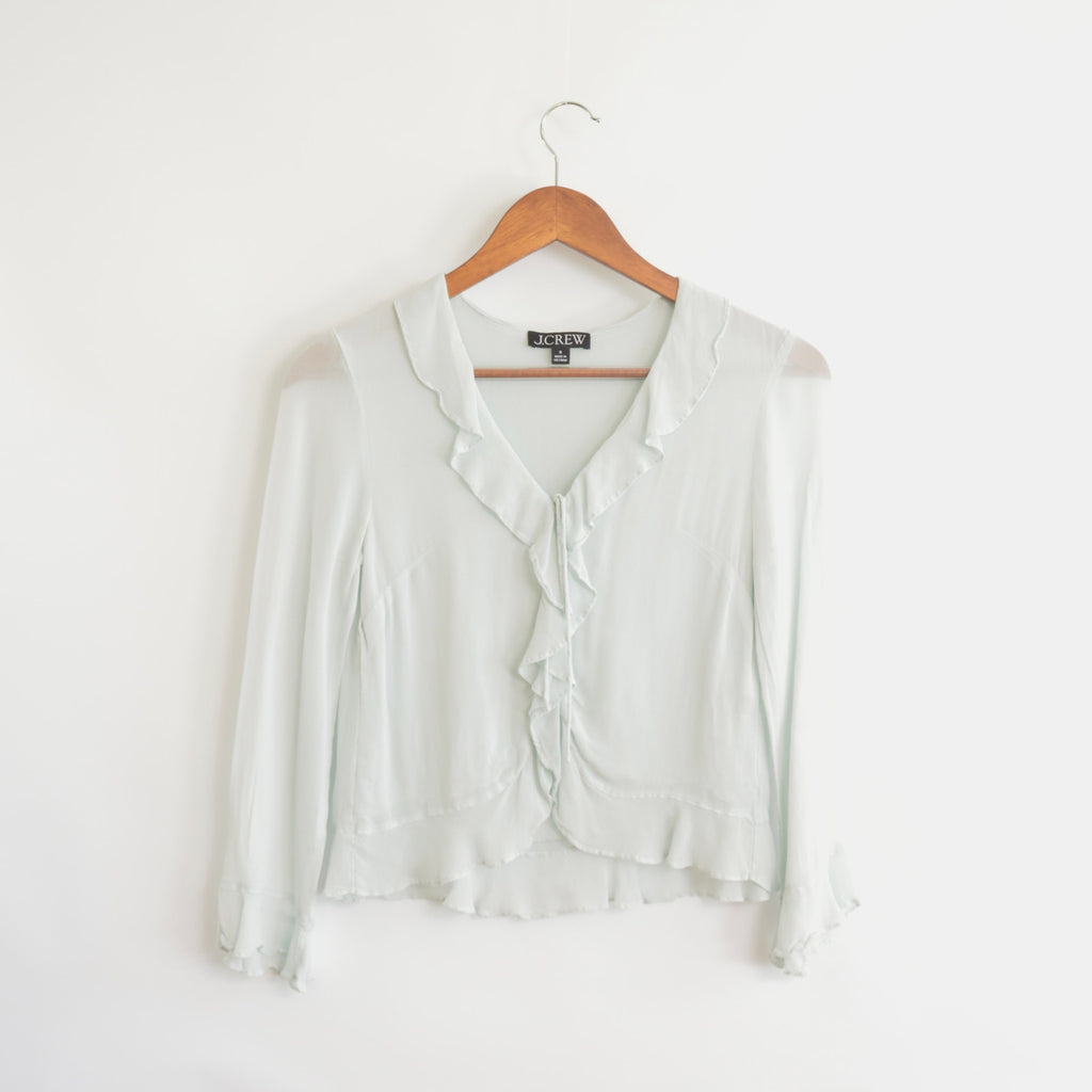 light blue cropped ruffly tie front blouse