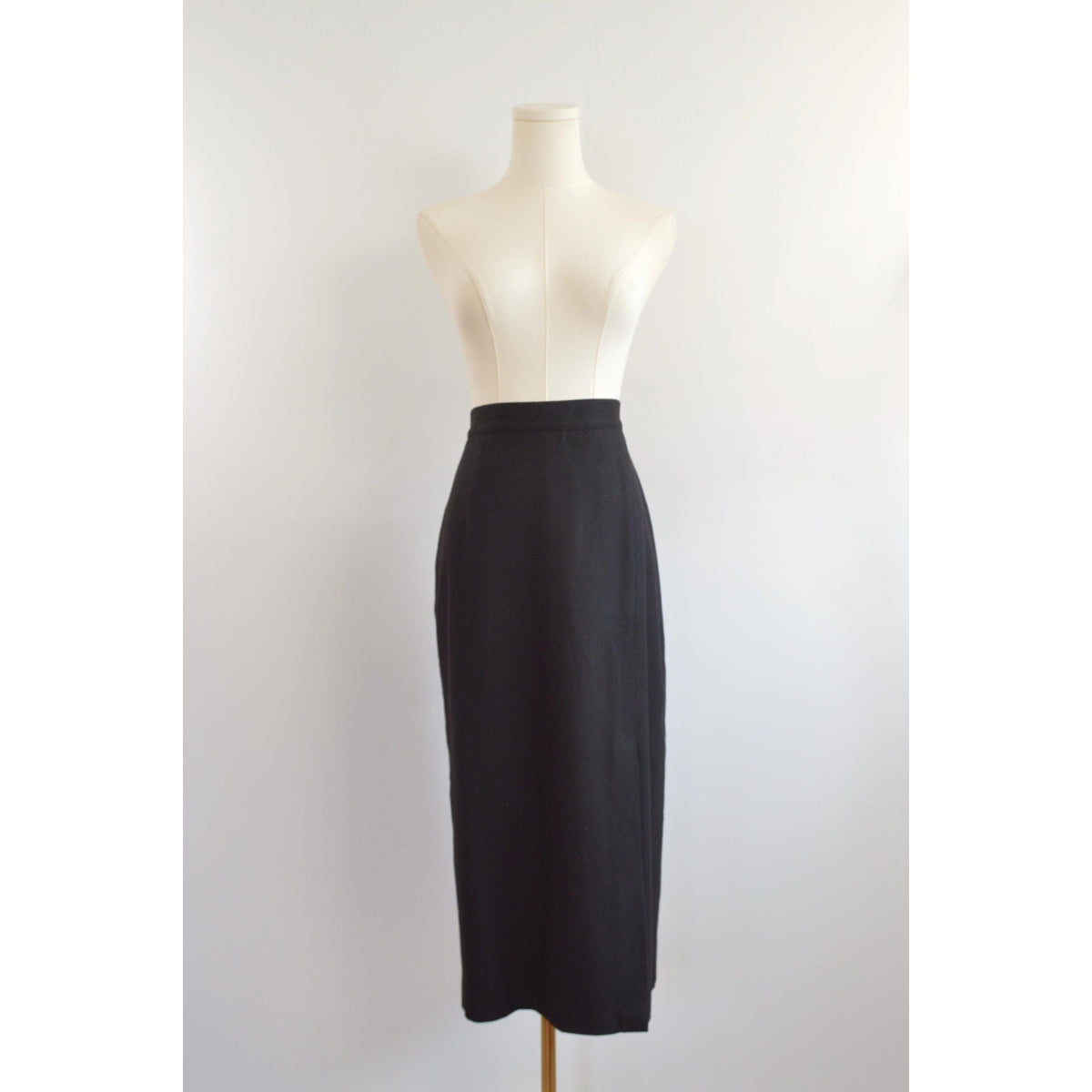 medium black wool midi skirt with off center front slit and full lining