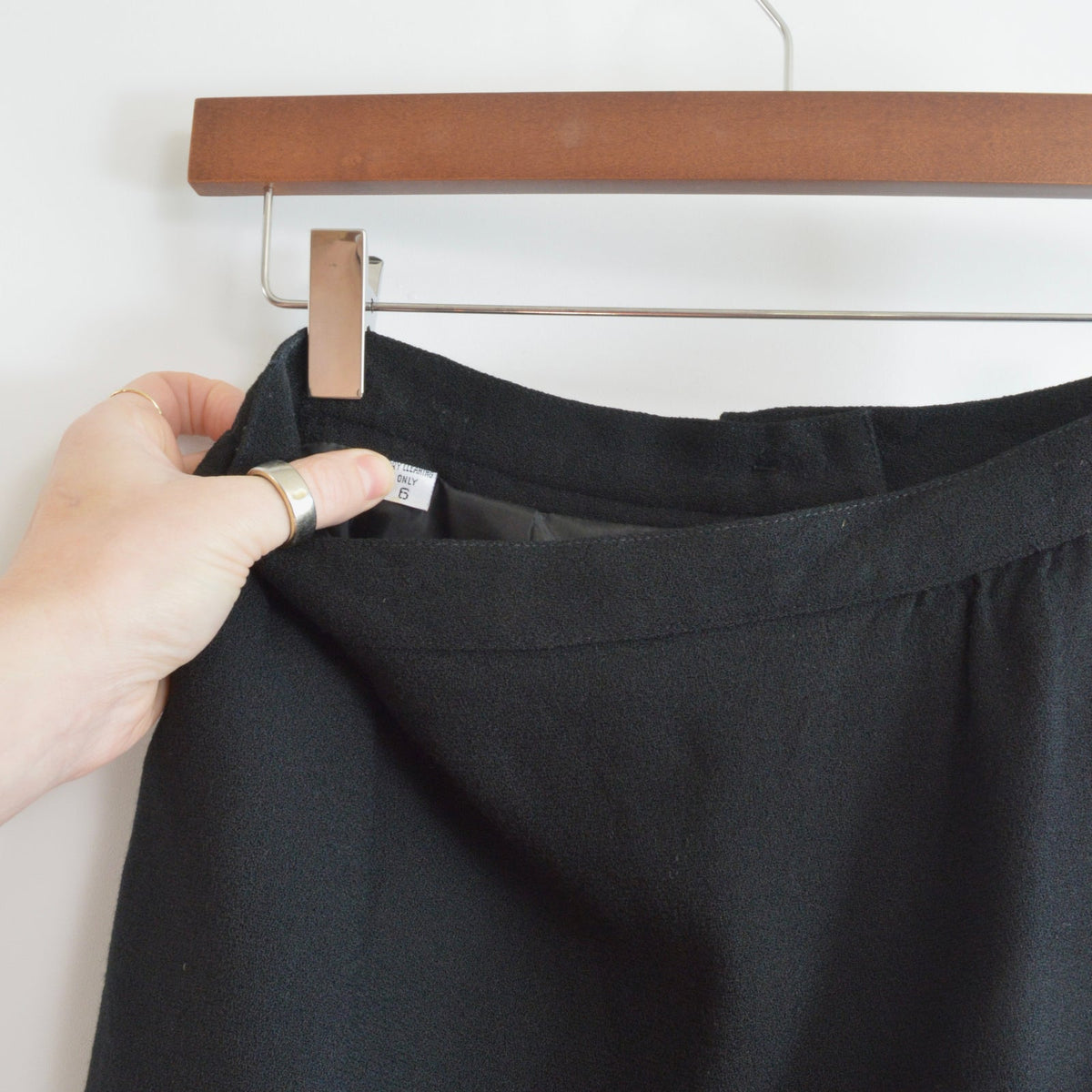 fully lined knee length black wool skirt with pockets