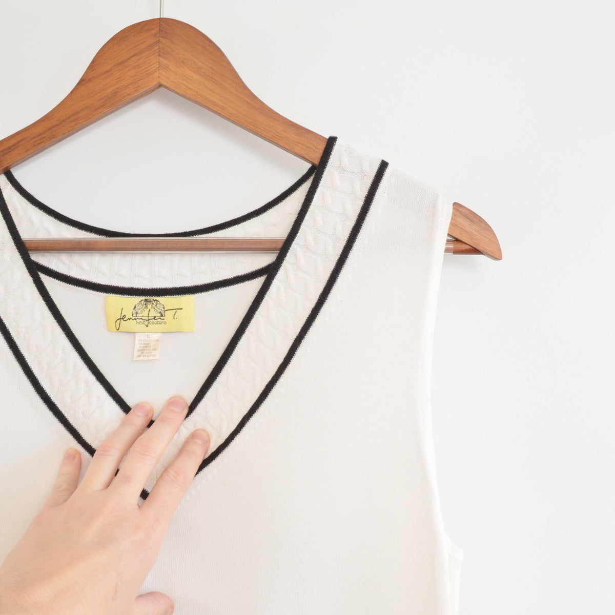 pretty white sweater knit tank with contrasting black trim