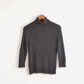 black cable knit cotton/cashmere/angora turtleneck with beige trim