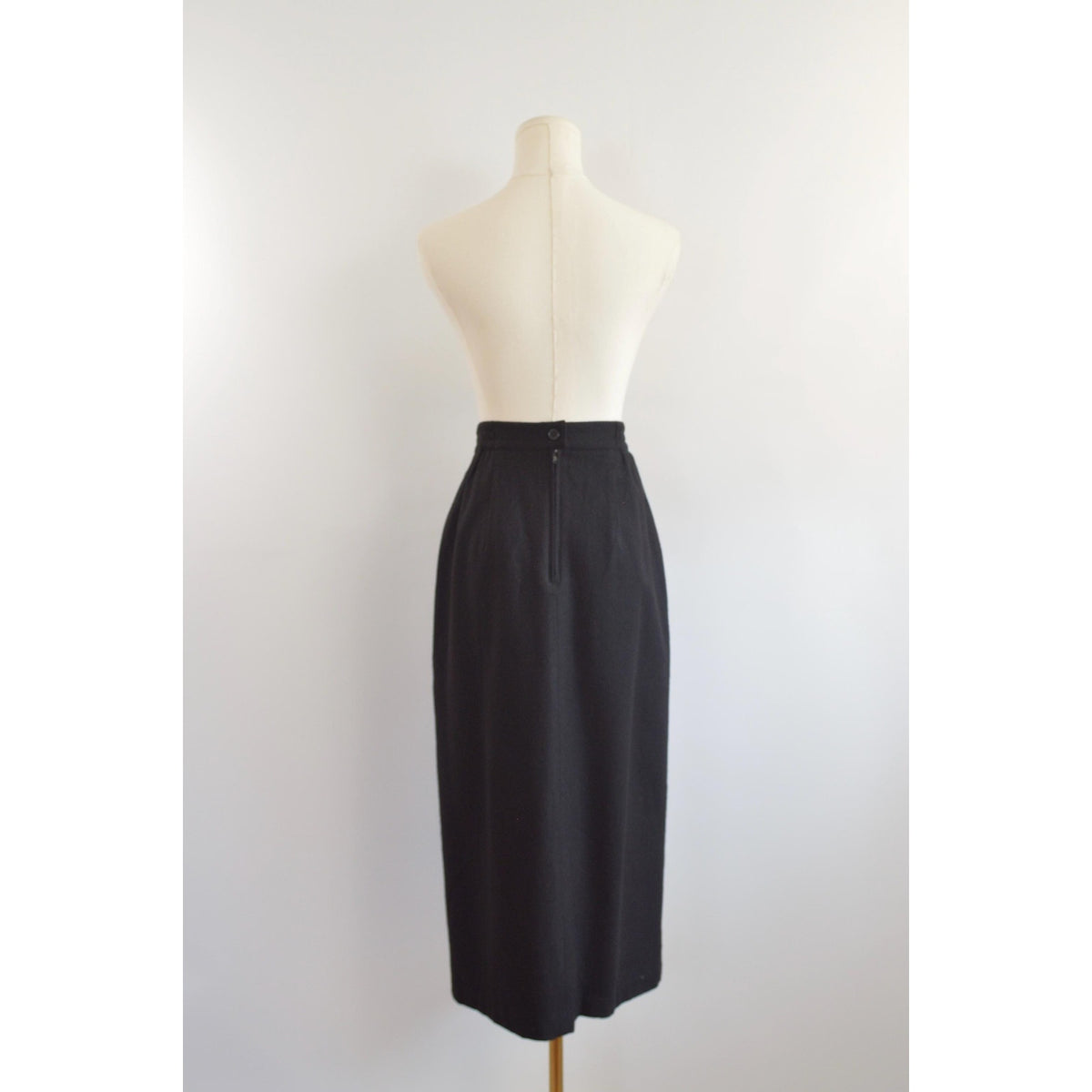medium black wool midi skirt with off center front slit and full lining