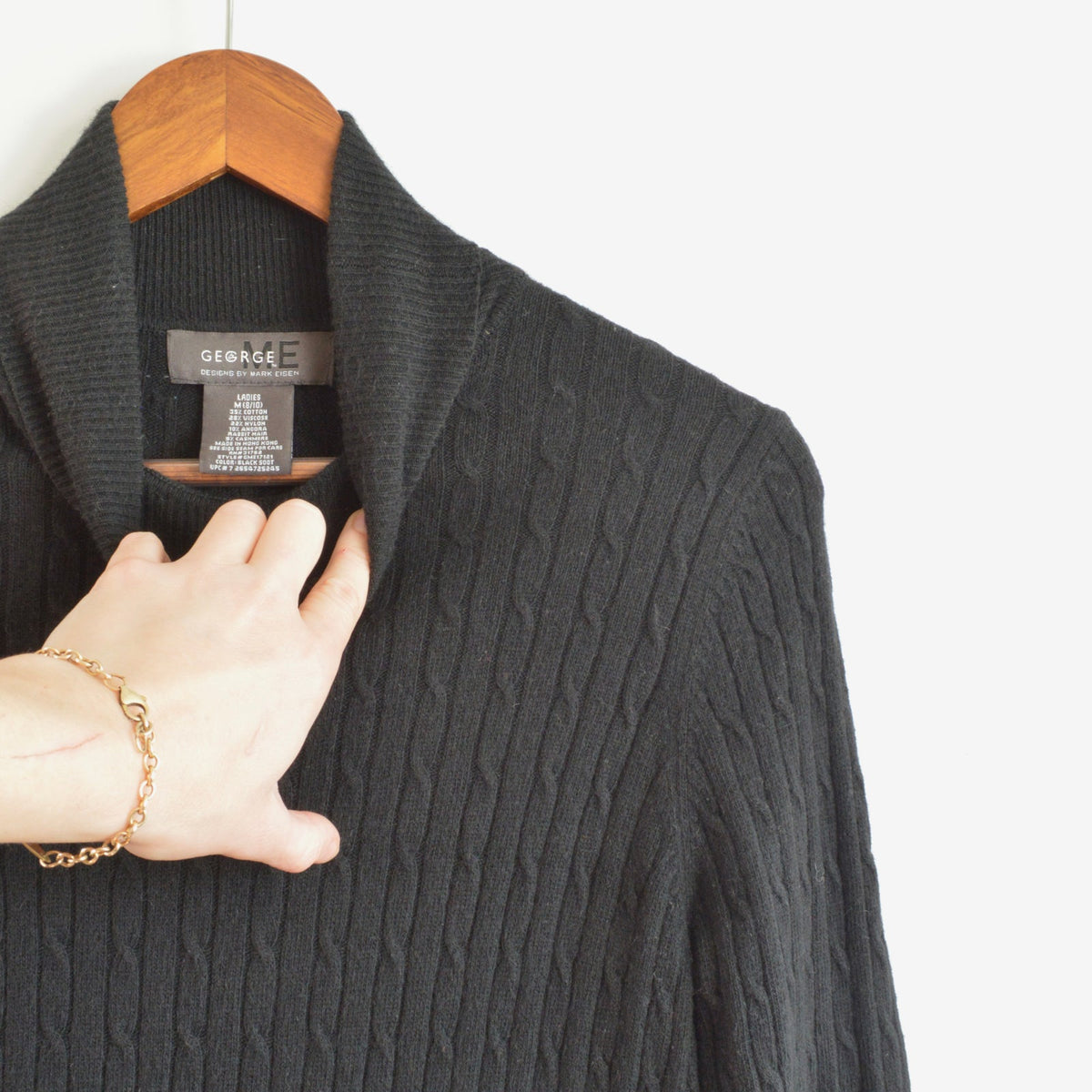 black cable knit cotton/cashmere/angora turtleneck with beige trim