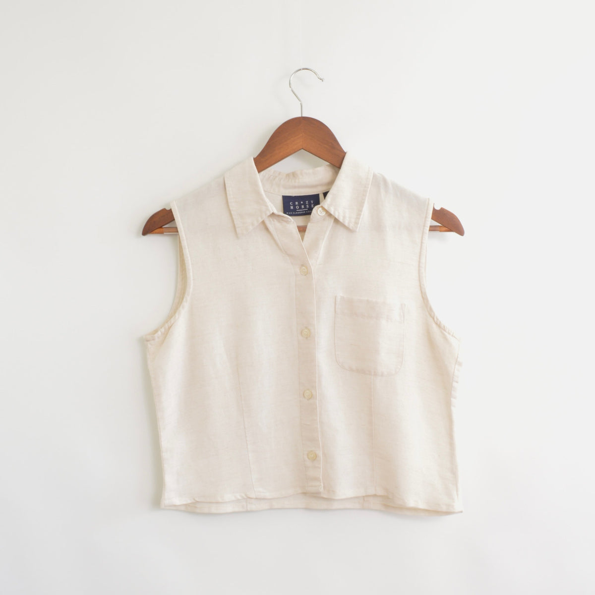 light blush tan cropped linen blend button down tank