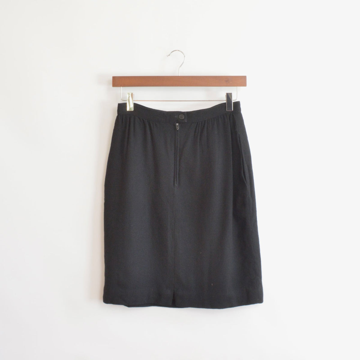 fully lined knee length black wool skirt with pockets