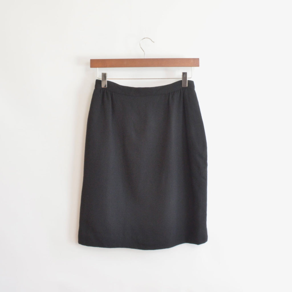 fully lined knee length black wool skirt with pockets